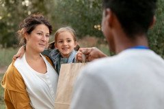 close-up-people-with-food-donations_23-2149182028