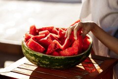 woman-s-hand-taking-watermelon-copy-space