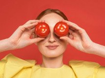 redhead-woman-holding-tomatoes_23-2148851900